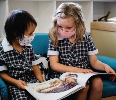 Two girls reading